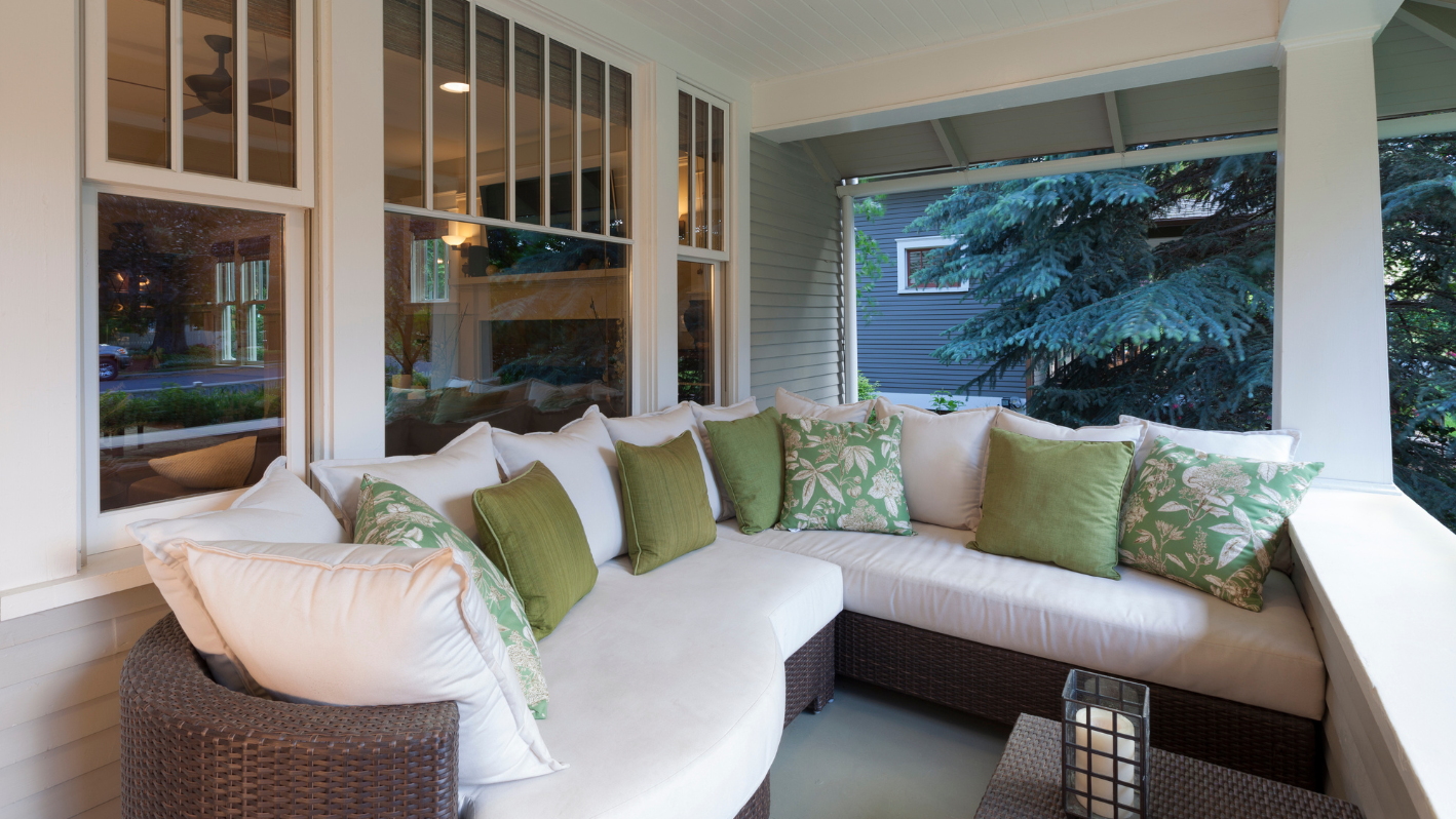 A white couch sitting on top of a wooden floor