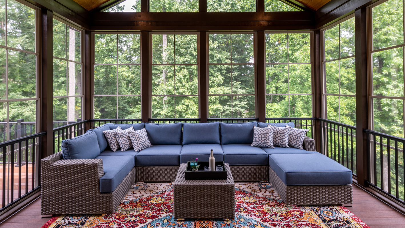 A blue couch sitting on top of a wooden floor